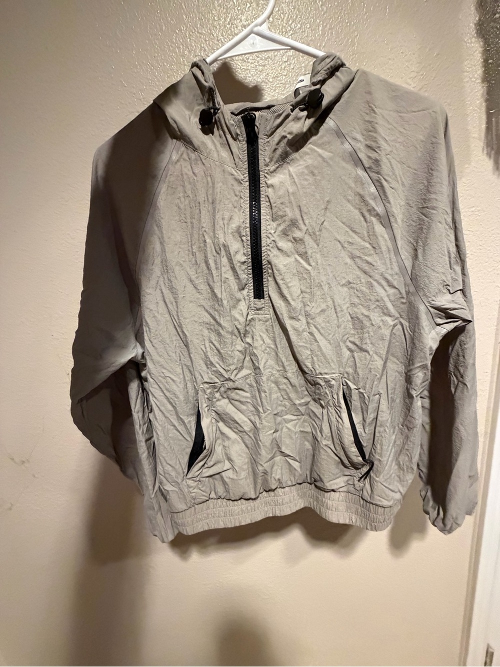 Peloton women’s Light Beige Windbreaker with Mesh Lining